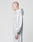 A person with a shaved head models the LIVE FAST DIE YOUNG Basic Script Hooded Zip and matching sweatpants in light gray Baumwolle-Polyester, standing in profile against a plain white background.