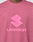 A close-up of a person wearing the Live Fast LF Tee by LIVE FAST DIE YOUNG, featuring a bold abstract front logo above "LIVEFAST" in pink block letters. The oversize fit adds comfort.