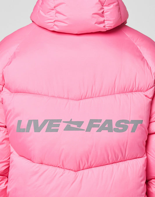 The Live Fast Puffer Jacket by LIVE FAST DIE YOUNG is a vibrant pink nylon jacket with an oversized fit, featuring "LIVE FAST" in bold reflective print across the back.