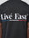 Back view of the Live Fast Paris Tee by LIVE FAST DIE YOUNG: black regular fit, “Livé Fast” in bold white letters above blue, white, and red stripes; 100% Baumwolle with front and back print details.