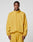 A man wears the LIVE FAST DIE YOUNG LFDY Trackjacket in an oversize fit, mustard yellow with reflective print, along with matching pants. He stands facing forward against a plain light gray background.