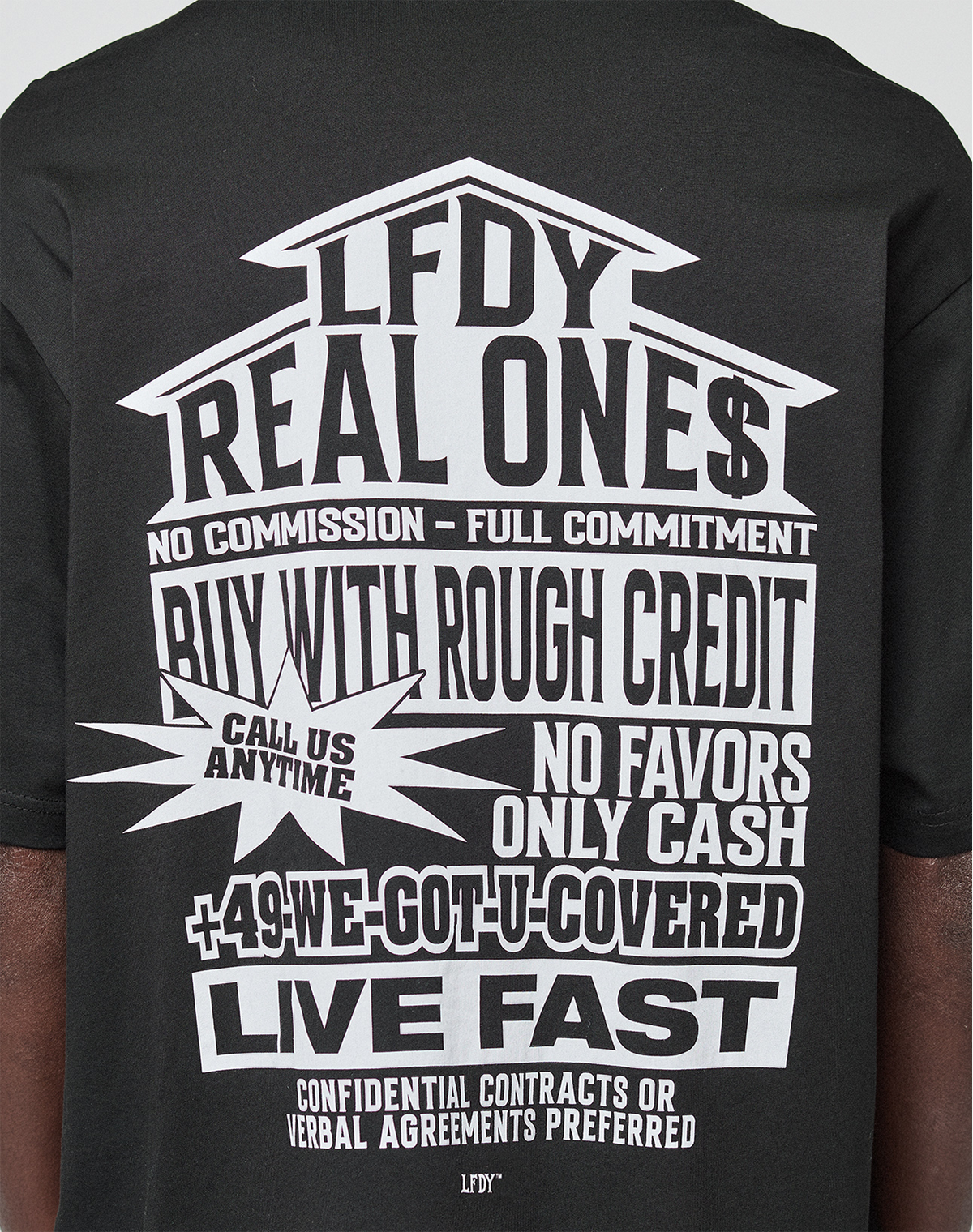 The LFDY Real Ones Tee by LIVE FAST DIE YOUNG is a black oversize-fit T-shirt made from 100% cotton, featuring bold white graphic front and back prints with phrases like REAL ONE$, BUY WITH ROUGH CREDIT, and LIVE FAST.