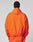 A person wearing the LIVE FAST DIE YOUNG Live Fast Trackjacket with reflektierender Druck and matching orange pants, seen from behind against a plain light background.