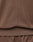 Close-up of brown fabric clothing, showing the seam and waistband detail, likely part of the LFDY Lightweight Hooded Zip by LIVE FAST DIE YOUNG. The 100% Baumwolle texture and precise stitching are clearly visible.