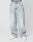 A person wears LIVE FAST DIE YOUNG’s LFDY Baggy Denim—light-wash, high-waisted, wide-leg jeans with a baggy fit made from 100% cotton—paired with white sneakers, standing against a plain white background. Only their lower half is visible.