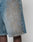 A close-up of a person wearing LFDY Tire Tracks Jorts from LIVE FAST DIE YOUNG—light blue, 100% Baumwolldenim shorts with a unique bleach pattern, visible seams, and a baggy fit for comfort and style.