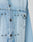 Close-up of the LFDY Trucker Jacket by LIVE FAST DIE YOUNG in light blue denim, showcasing metal buttons, detailed stitching, and a buttoned left chest pocket. The Baumwolle fabric features a subtly faded, worn-in look.
