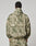 A person stands facing away, wearing the LIVE FAST DIE YOUNG Live Fast Nylon Jacket in light green and beige camo with a hood and matching pants, hands at their sides against a plain light background.