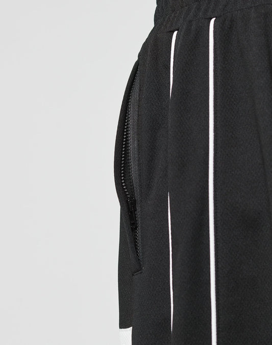 Close-up of the LFDY 55 Trackpants by LIVE FAST DIE YOUNG, featuring a side pocket with a black zipper, white vertical stripes, an elastic waistband for comfort, and a wide fit design made from durable polyester.