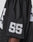 Close-up of the LFDY Mesh Jersey by LIVE FAST DIE YOUNG: a black polyester jersey with breathable mesh, oversize fit, and the number 55 in bold white print on the sleeve, modeled by a person with dark skin.