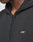 Close-up of a person in a black LIVE FAST DIE YOUNG Basic Hooded Zip with the hood up and distressed Kapuze. The hoodie features a white embroidered logo on the chest, partially obscuring the persons face and neck.