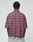 A person is shown from behind wearing a maroon plaid LFDY Light Flannel by LIVE FAST DIE YOUNG, made from 100% cotton, paired with light blue denim jeans against a plain white background.