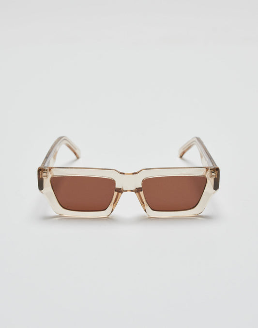 The Live Fast Sunglasses by LIVE FAST DIE YOUNG feature rectangular frames in transparent beige Mazzuchelli acetate, brown-tinted UV-protective lenses, and a subtle silver logo, shown on a plain white background.