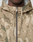 Close-up of a person wearing the LIVE FAST DIE YOUNG LFDY Camo Halfzip Jacket in an oversize fit, featuring a tan and green camouflage pattern and silver zipper, shown from shoulders to chin.