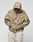 A person wears the LFDY Camo Halfzip Jacket by LIVE FAST DIE YOUNG, a tan and beige camo hooded jacket with "CALL US 49 Live Fast" on the front and an oversize fit. Hands in pockets, they face down against a plain white background.