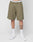 A person wears LIVE FAST DIE YOUNG Basic Knit Shorts in olive green with a white LIVE FAST waistband, paired with LF white socks and white sneakers, standing against a plain light gray background.