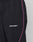 Close-up of LIVE FAST DIE YOUNGs LFDY Wavy Trackpants: black athletic pants with a white LIVE FAST™ logo, thin pink side stripe, elastic waistband, wide fit, and side pocket.