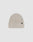 The LIVE FAST DIE YOUNG Double Rib Knit Beanie in light beige features a folded brim, double-layer ribbed construction for a voluminous look, and a small black rectangular tag on the cuff, shown against a plain white background.