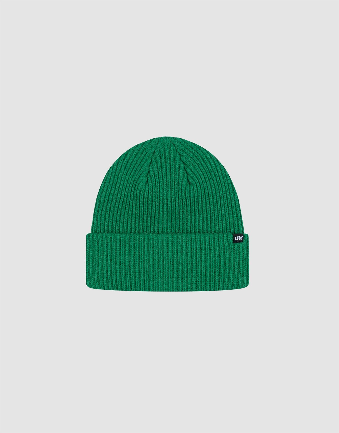 The Double Rib Knit Beanie by LIVE FAST DIE YOUNG is bright green, doppellagig gestrickt, with a folded cuff and small black side tag, offering a voluminöser Look against a plain light gray background.| plain
