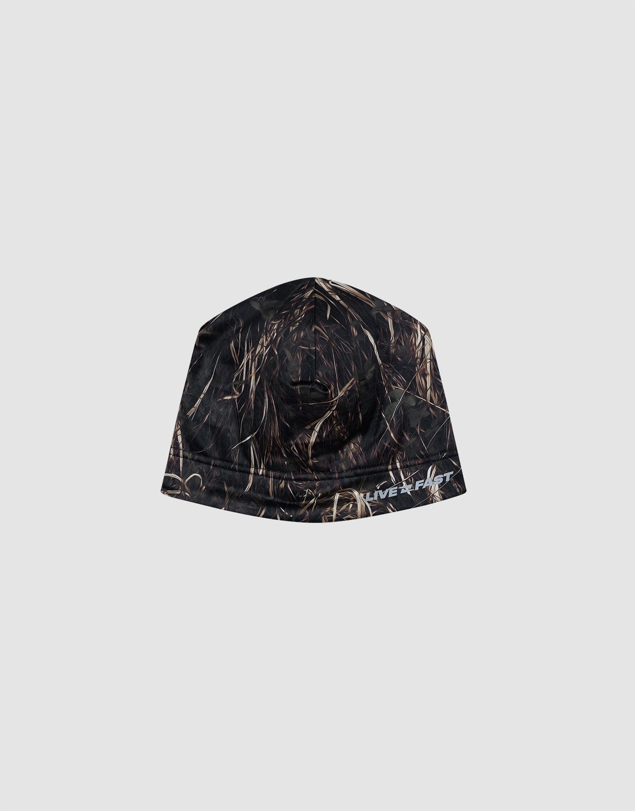 The Live Fast Performance Beanie by LIVE FAST DIE YOUNG features a camouflage pattern with brown and tan grass streaks, a soft Fleece Innenseite, and a partial white "Silver" logo print. Displayed on a plain light gray background.| plain
