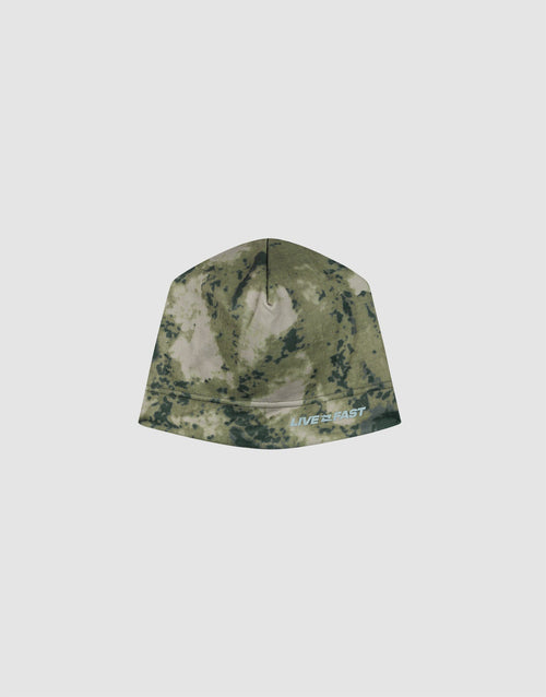 The Live Fast Performance Beanie by LIVE FAST DIE YOUNG features a green and beige camo print, a cozy fleece lining, and a white and blue "LIVE FAST" logo near the edge, displayed on a plain light gray background. 