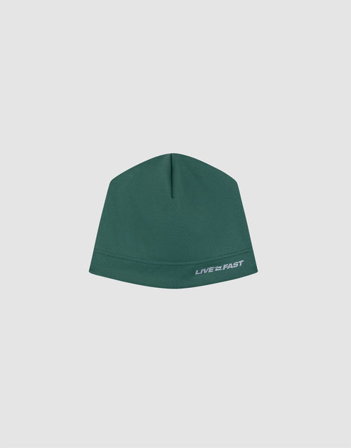 The Live Fast Performance Beanie by LIVE FAST DIE YOUNG is a green fitted hat featuring "LIVE FAST" in white near the edge, shown against a plain light gray background. 