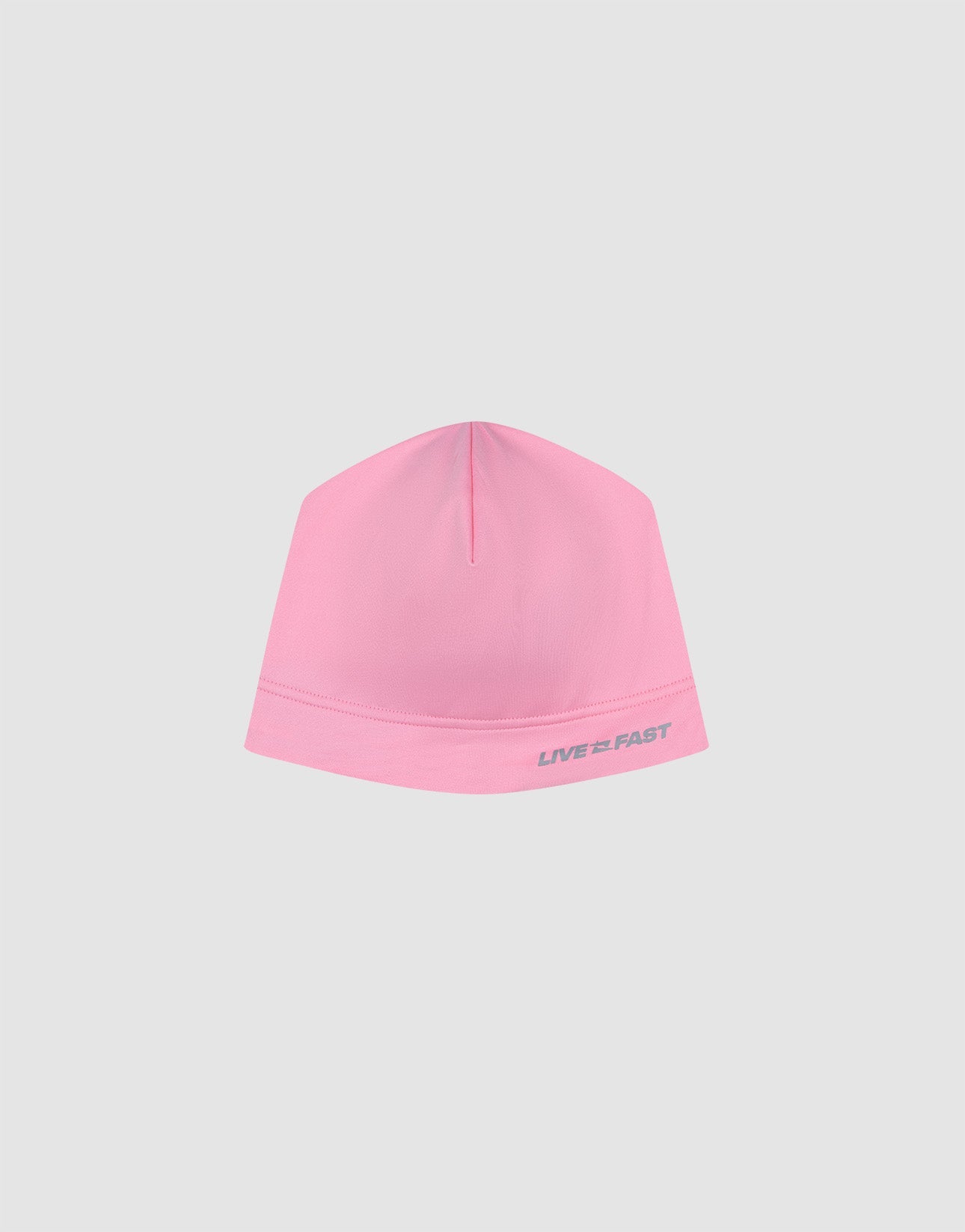 The Live Fast Performance Beanie by LIVE FAST DIE YOUNG features a light pink color, minimal design, and small gray “LIVE FAST” logo along the hem, shown against a plain light gray background.| plain