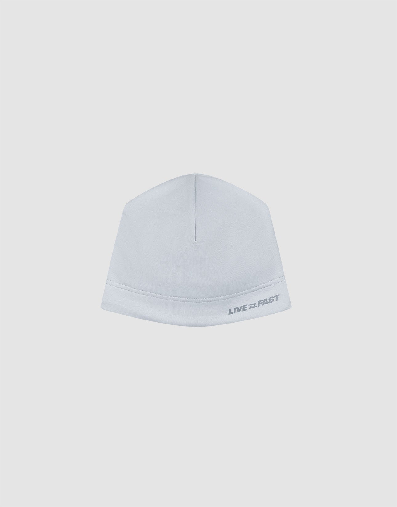 The Live Fast Performance Beanie by LIVE FAST DIE YOUNG is a plain white fitted beanie with "LIVE FAST" in gray on the lower right, featuring a dünne Fleece Innenseite, displayed on a light gray background.| plain