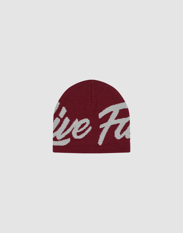 The LFDY Jacquard Beanie by LIVE FAST DIE YOUNG is a maroon polyamide knit hat with bold white Logo Strick script lettering across the front, shown on a plain light gray background.| plain 