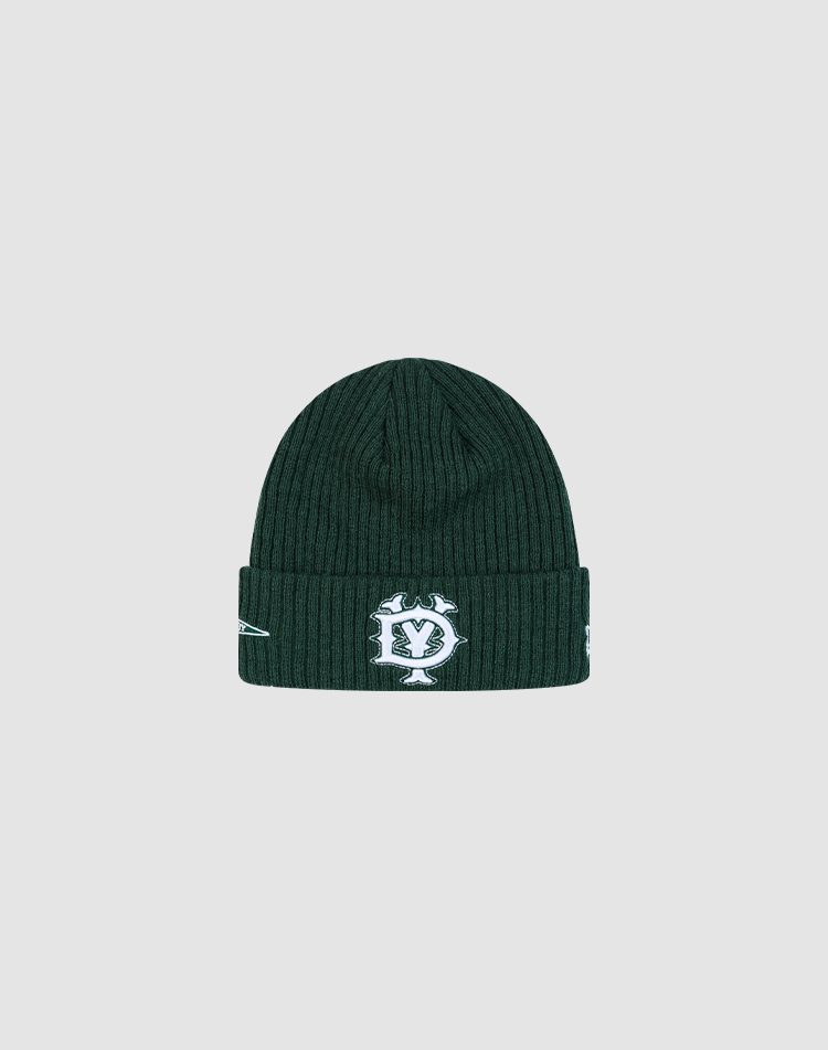 The LFDY x New Era Beanie by LIVE FAST DIE YOUNG is a dark green ribbed knit beanie with a white embroidered DY logo and symbols on the folded cuff, shown against a plain light gray background. 