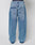 A person seen from the back wears LIVE FAST DIE YOUNG’s LFDY Baggy Denim jeans in light blue with large back pockets, a visible waistband, and a wide straight leg for a relaxed silhouette.