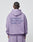 Seen from behind, a person with braided hair wears the LIVE FAST DIE YOUNG Basic 360 Hooded in Oversize Fit, lavender, with bold back text LiveFast HvySweat 360g/m² and smaller print below. Vintage-washed Baumwolle-Polyester blend.