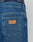 Close-up of Wide Denim jeans by LIVE FAST DIE YOUNG: blue denim with a brown LFDY patch, 100% cotton, regular fit with a stylish wide leg. Navy waistband shows LIVE FAST in white on the underwear.