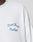 Close-up of the LÉquipe Waffle Longsleeve by LIVE FAST DIE YOUNG: a white textured oversized shirt with blue Live Fast Rallye embroidery on the chest.