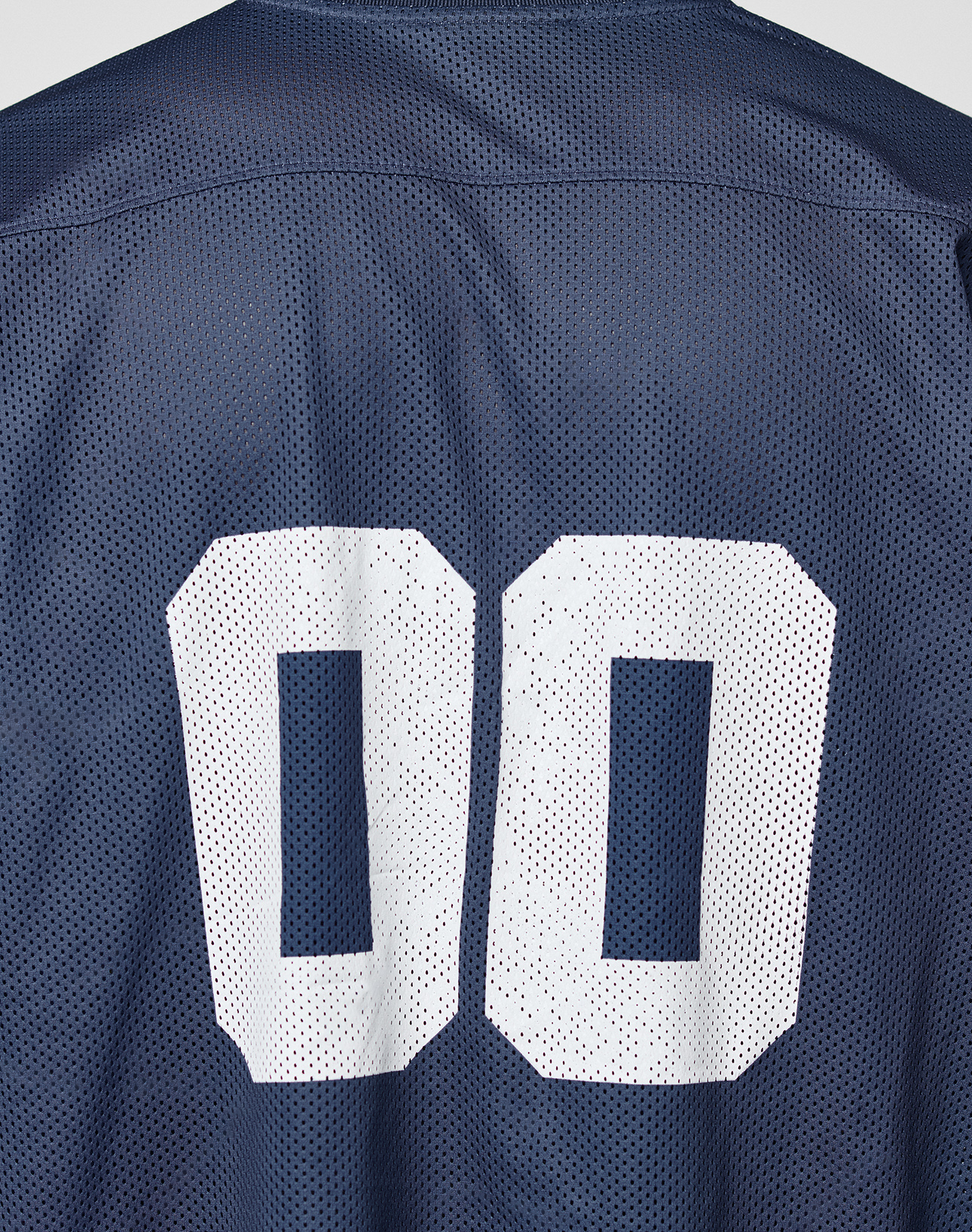 A close-up of the back of the LFDY Mesh Jersey by LIVE FAST DIE YOUNG, crafted from dark blue polyester mesh with a bold white 00 printed on it.