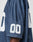 A close-up of the LFDY Mesh Jersey by LIVE FAST DIE YOUNG in navy blue polyester mesh, featuring an oversize fit and white 00 on the sleeve. The wearer’s arm is shown against a plain background.
