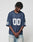 A person with short dreadlocks wears the LFDY Mesh Jersey by LIVE FAST DIE YOUNG in navy blue, featuring an oversize fit, V-Ausschnitt, and number 00 on front and sleeves, standing with hands clasped against a plain background.
