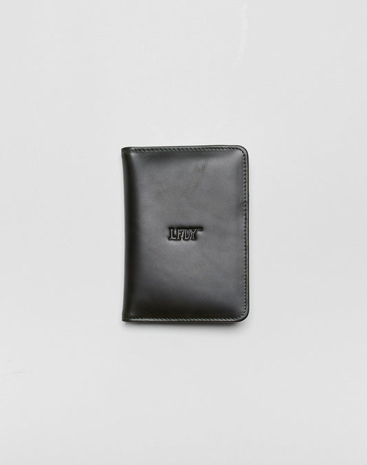 A closed black LFDY Passport Case by LIVE FAST DIE YOUNG with rounded corners, center LFDY embossing, and multiple card slots, shown on a plain light gray background. 