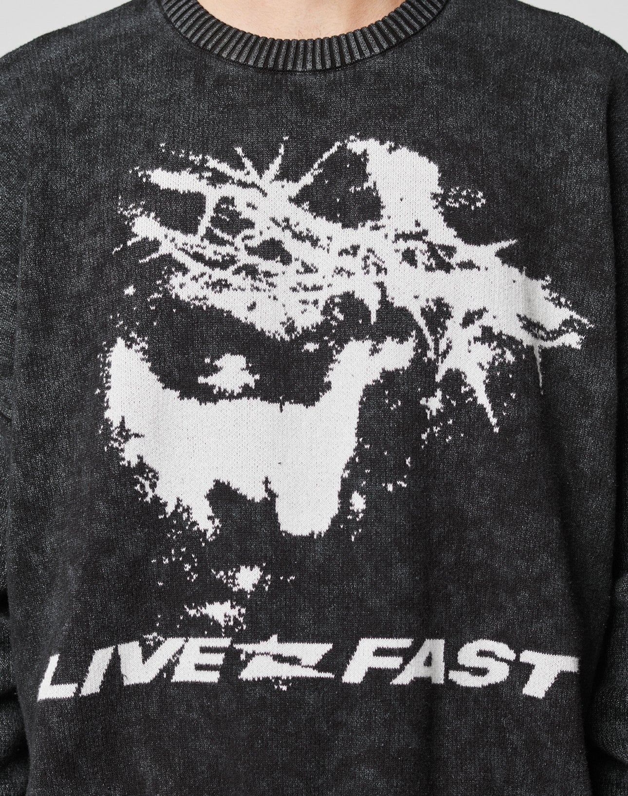 The LFDY Savior Knit Sweater by LIVE FAST DIE YOUNG features a vintage-wash dark knit, white abstract dog and tree graphic, bold LIVE FAST lettering, and is made from 100% Baumwolle for comfortable wear.