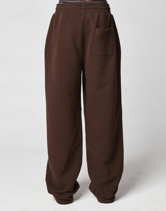 The LFDY Pleated Jogger by LIVE FAST DIE YOUNG features a loose fit, dark brown color, single front pocket, and comfortable elastic waistband, displayed on a plain white background.