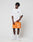 A person with short, styled hair stands in a relaxed pose against a white background, wearing the LIVE FAST DIE YOUNG LFDY Praying Tee, orange shorts with white graphics, white socks, and sneakers.
