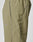 Close-up of the Live Fast Trackpants by LIVE FAST DIE YOUNG in light olive green, showcasing a zippered side pocket, reflective logo print, piping along the seams, and an elastic drawcord waist against a plain background.