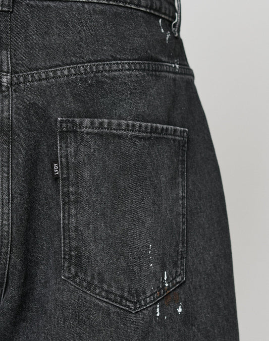 Close-up of the back pocket on LIVE FAST DIE YOUNGs LFDY Baggy Denim, featuring splashes of color near the bottom and showcasing their signature baggy fit style.