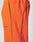 Close-up of bright orange Live Fast Trackpants by LIVE FAST DIE YOUNG, featuring a wide elastic waistband, black piping, and a reflective FAST logo print near the left pocket.