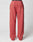 The LIVE FAST DIE YOUNG Live Fast Sweatsuit Jogger is a pair of loose-fitting, coral pink sweatpants with an Elastik-Bund waistband, back pocket, and oversize fit, shown on a plain white background.