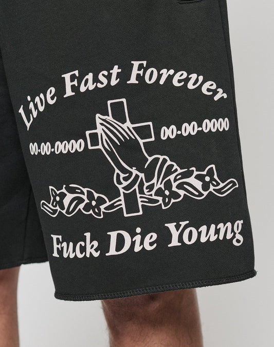 LFDY Praying Shorts by LIVE FAST DIE YOUNG: Black shorts with white Live Fast Forever, Fuck Die Young text, praying hands, cross, floral design, placeholder dates, side pockets (seitliche Eingrifftaschen), and elastic waistband for a comfortable regular fit.