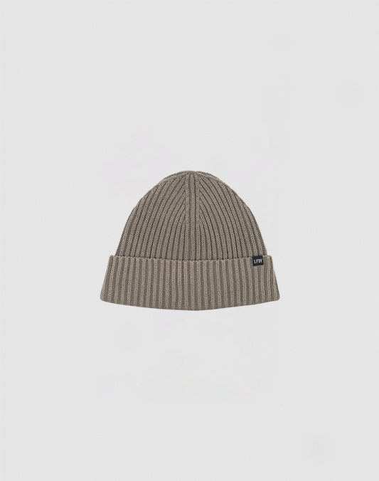 The LIVE FAST DIE YOUNG Rib Knit Beanie in olive-green cotton features a folded brim and a small black side tag, shown against a plain white background.
