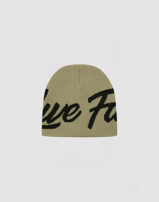 The LFDY Jacquard Beanie by LIVE FAST DIE YOUNG is a khaki green knit in soft Polyacryl, featuring a large black cursive logo across the front. Model LF2411-16604. Shown on a plain light gray background.