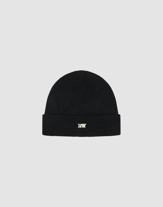 The Live Fast Boucle Beanie by LIVE FAST DIE YOUNG is a black polyester knit, one size, with a folded brim and a small white embroidered logo on the front, shown against a plain light gray background.| plain 