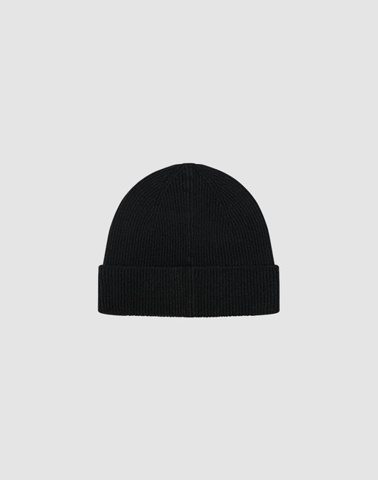 The LIVE FAST DIE YOUNG Live Fast Boucle Beanie is a black, ribbed knit polyester beanie with a folded brim, shown on a plain light gray background. This one-size style features subtle Metall-Branding for a modern touch.